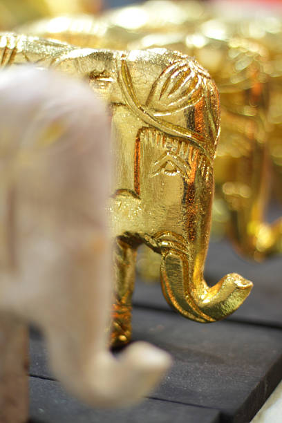 Golden Elephant ornament on sale at night market stock photo