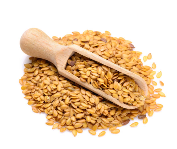 Golden flax seeds in a scoop stock photo