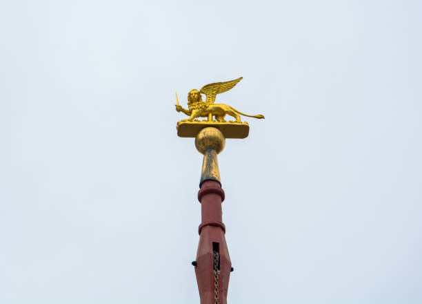 golden lion on a pillar - a symbol of venice near the chiesa del santissimo redentore - golden lion imagens e fotografias de stock