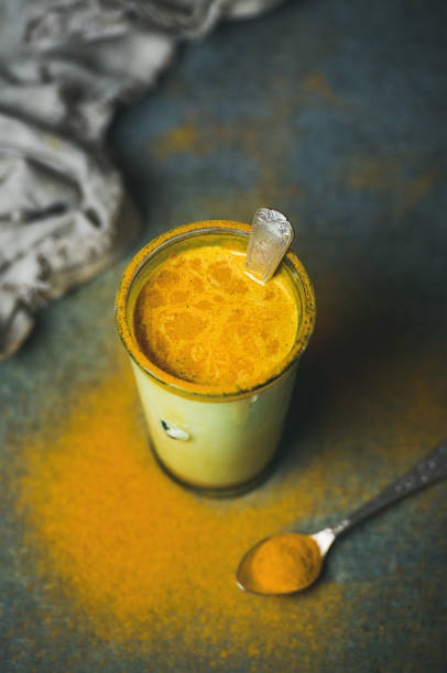 golden milk with turmeric powder, clean eating detox concept - boosting imagens e fotografias de stock
