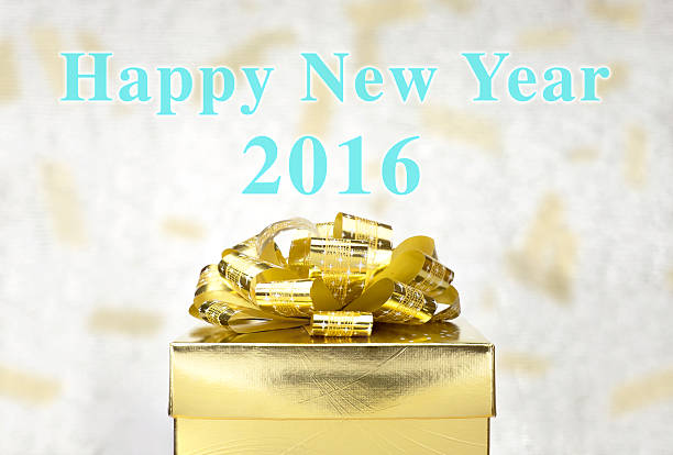 Golden Present with Happy New Year 2016 word at bokeh Golden Present box with Happy New Year 2016 word at bokeh light background, Holiday concept. happy new year card 2016 stock pictures, royalty-free photos & images