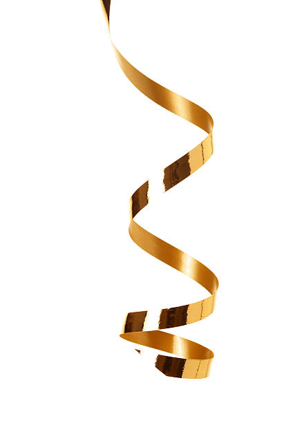 A golden ribbon streamer against a white background stock photo