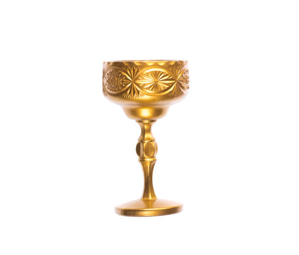 golden royal wine glass on a white background golden royal wine glass on a white background chalice photos stock pictures, royalty-free photos & images