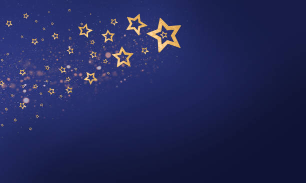 Golden Stars on Gradient Blue Background stock photo