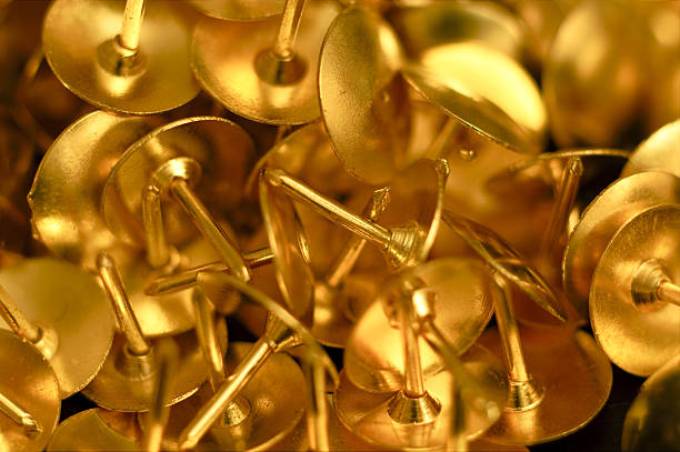 Golden tacks stock photo