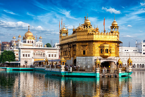 Golden Temple, Amritsar Famous indian landmark - Sikh gurdwara Golden Temple (Harmandir Sahib). Amritsar, Punjab, India golden temple india stock pictures, royalty-free photos & images