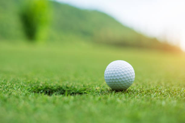Golf ball on green grass ready to be struck at golf club Golf ball on green grass ready to be struck at golf club,close up in golf coures at Thailand af_istocker stock pictures, royalty-free photos & images