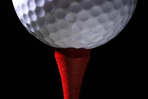 Golf Ball on Red Tee stock photo