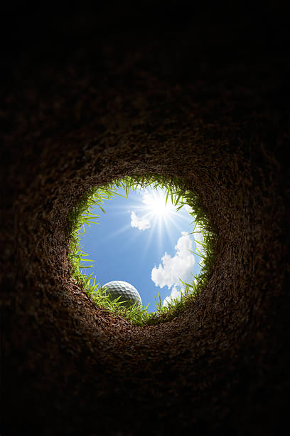 golf ball golf ball view from inside the hole hole stock pictures, royalty-free photos & images