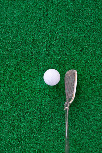 golf club and ball on the artificial turf stock photo
