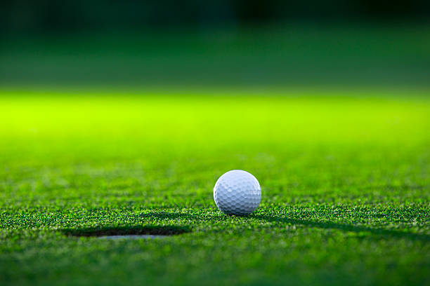 Golf Golf ball on the lawn green golf course stock pictures, royalty-free photos & images