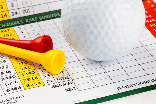 Golf Scorecard with Ball and Tees stock photo