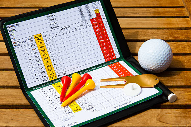 Golf scorecard with golfing accessories stock photo