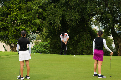 Golfer Making The Putt Stock Photo - Download Image Now - iStock