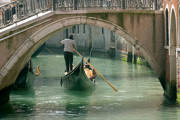 Gondola in Venice under old bridge (XXL) stock photo