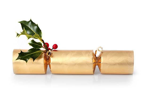 Good Christmas cracker with holly tied to it stock photo