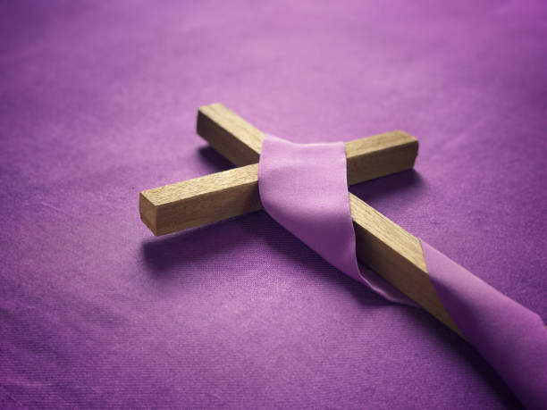 Good Friday, Lent Season and Holy Week concept. A religious cross placed on purple background. lent stock pictures, royalty-free photos & images