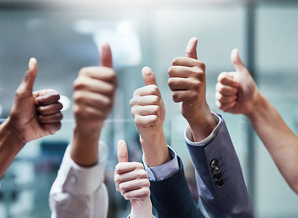 Good job! Shot of a group of hands showing thumbs up business thumbs up stock pictures, royalty-free photos & images