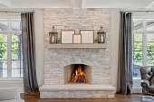 istock Gorgeous stone fireplace with wood mantel 1276740276