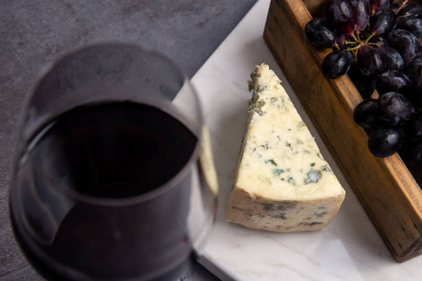 Gorgonzola Cheese - Blue Cheese - Wine - Grapes Gorgonzola Cheese - Wine muenster cheese stock pictures, royalty-free photos & images