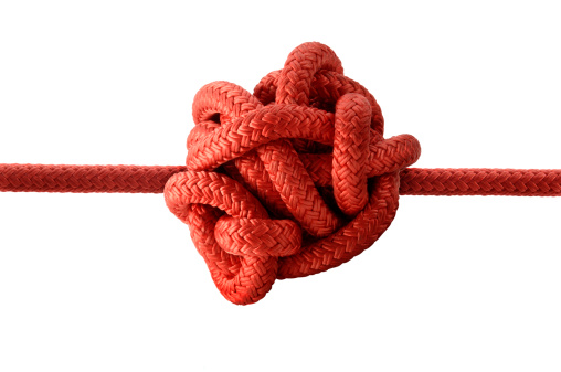 Knotted Red Rope on White.