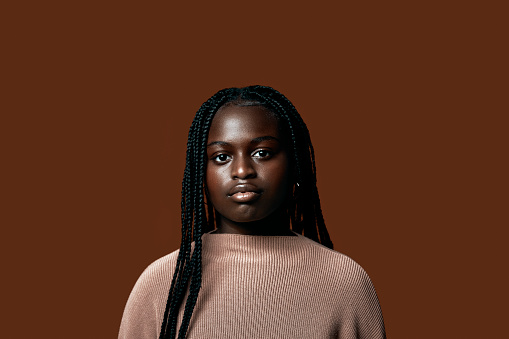Studio portrait of beautiful serious African teenager
