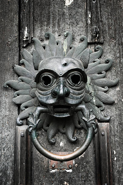 Gothic Door Knocker Durham Cathedral A gothic style door knocker at the main entrance to Durham Cathedral in the UK. Legend has it that anyone on the run from the authorities of the time could claim sanctuary within the cathedral if the reached the door knocker before their pursuers did! Durham Cathedral stock pictures, royalty-free photos & images
