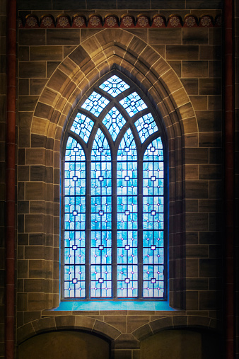 Gothic window with colored stained glass in Germany