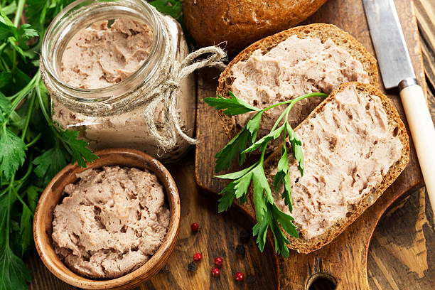 Gourmet liver pate Chicken liver pate with bread on a wooden boardChicken liver pate with bread on a wooden board pate stock pictures, royalty-free photos & images