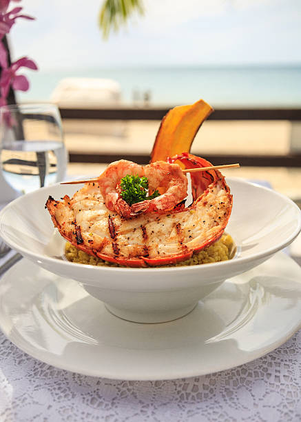Gourmet Lobster and shrimp seafood by the sea Gourmet and delicious lobster and shrimp seafood plate by the beach caribbean culture stock pictures, royalty-free photos & images