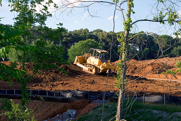 grading dozer grading on housing construction siteCheck out my erosion control stock pictures, royalty-free photos & images