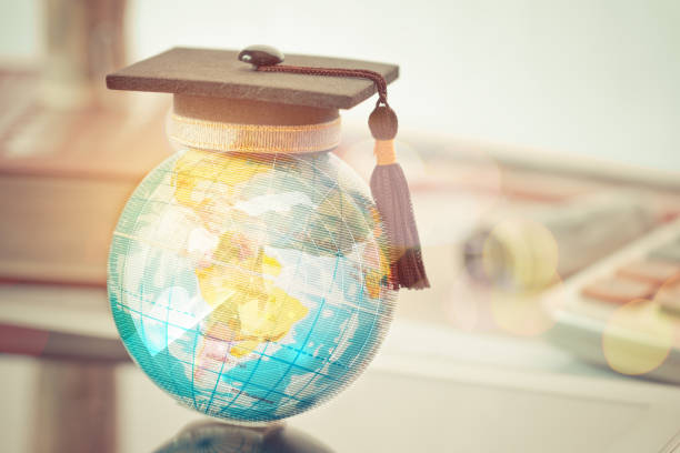 Graduate study abroad concept, Graduation cap on top Earth globe model map with Radar background. Graduate study abroad program and Back to School and Studies lead to success in world wide. stock photo