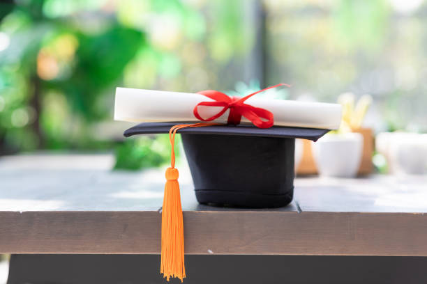Graduation cap and certificated or diploma for graduated,Education Success Concept stock photo