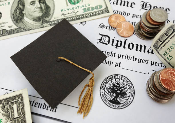 graduation cap money and diploma College or high school diploma with mini graduation cap and money student loan stock pictures, royalty-free photos & images