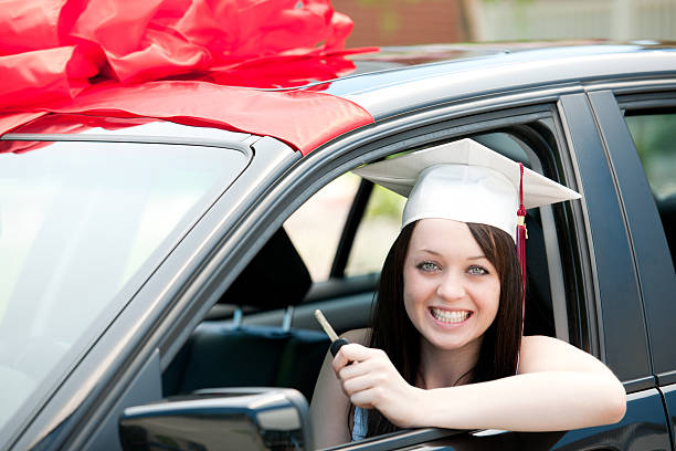 Graduation Present A girl receives a new car from her parents. car loan stock pictures, royalty-free photos & images
