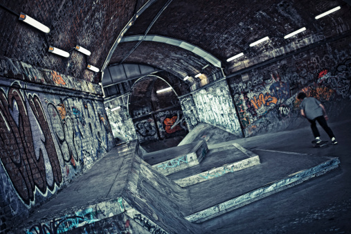 Graffiti covered skatepark.