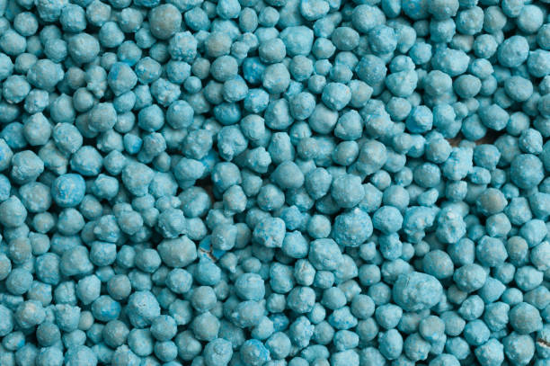 Grains of nitrogen fertilizer for agricultural use Grains of nitrogen fertilizer for agricultural use ammonia stock pictures, royalty-free photos & images