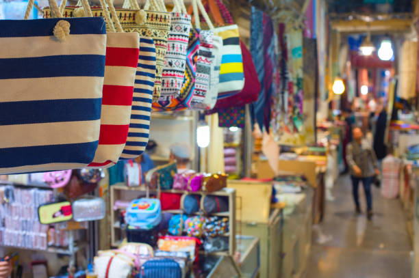 Grand Bazaar market in Tehran, rows of colorful textile crafts shops,...