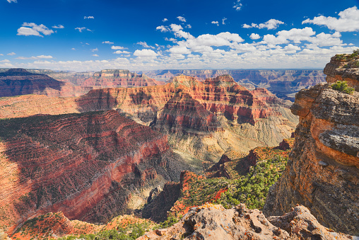 Grand Canyon National Park with blue sky and clouds.