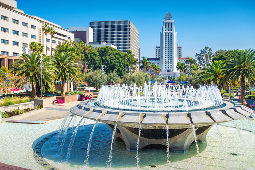 Fountain in Grand Park in downtown Los Angeles with the City Hall in the background.