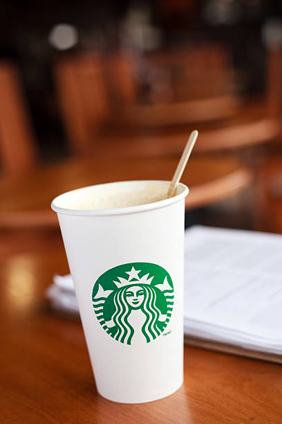 Grande Starbucks hand crafted beverage with stir stick stock photo