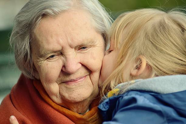 Grandmother and granddaughter. Happy family. stock photo