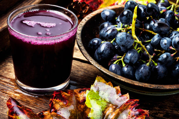 Grape drink in a glass stock photo