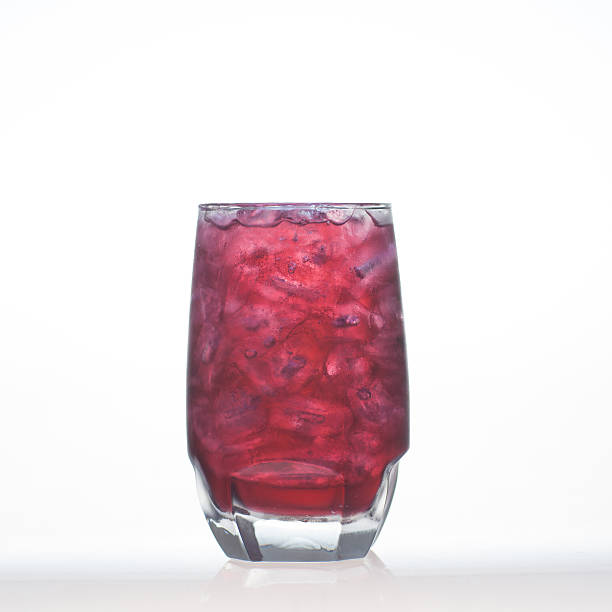 Grape flavor aerated drinks whit soda in glass isolated stock photo