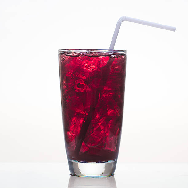Grape juice with ice in glass isolated stock photo