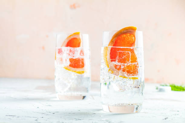 Grapefruit gin cocktail, refreshing drink with ice stock photo