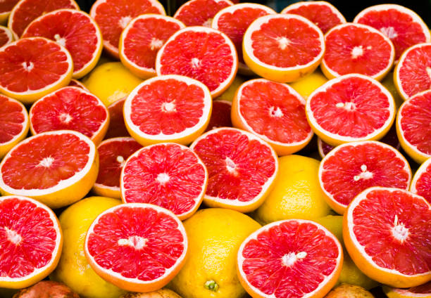 Grapefruits on stall, Citrus paradisi stock photo