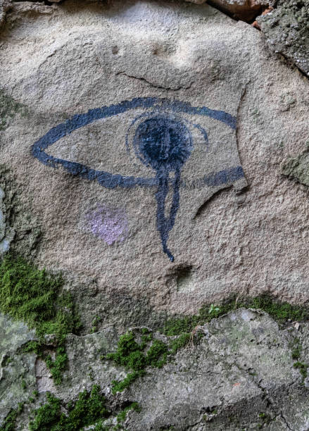 graphite of eye on a stone wall - tadic stockfoto's en -beelden