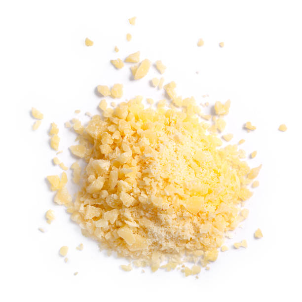 Grated parmesan grana cheese, top, paths Grated Parmesan cheese (Parmigiano, Grana), pile of, top view. Clipping paths, shadows separated parmesan cheese stock pictures, royalty-free photos & images