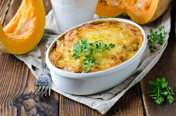 Gratin of pumpkin pasta and minced meat Gratin of pumpkin pasta and minced meat gratin stock pictures, royalty-free photos & images
